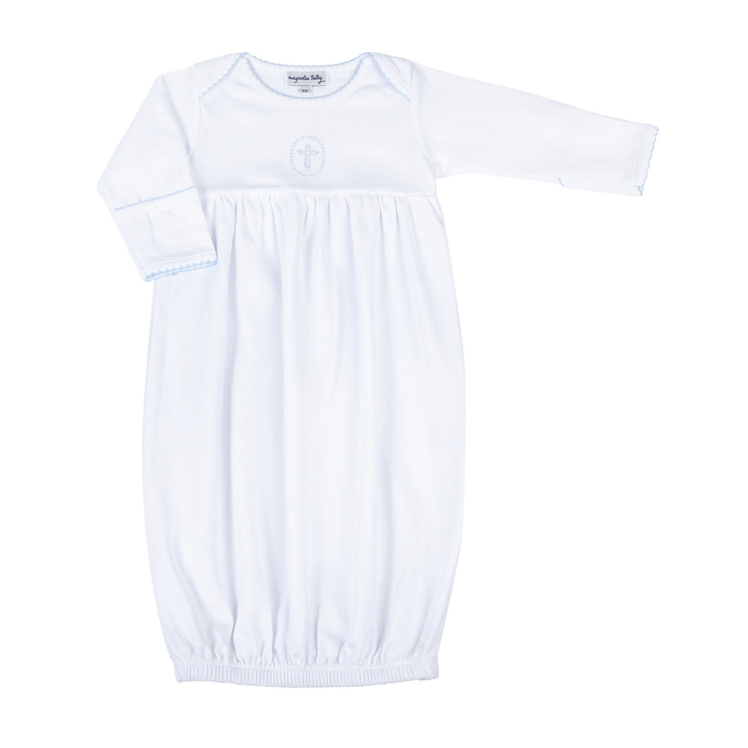 Welcome your little bundle of joy into the world with our Blessed Blue Smocked Boy Gown. Crafted from the softest materials, this gown features a delicate cross stitched in the center of the chest and intricate embroidery on the neckline and sleeves. Perfect for your little prince's first photos, this simple yet elegant design is sure to become a cherished keepsake for years to come.