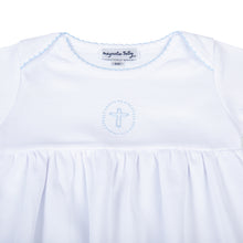 Load image into Gallery viewer, Welcome your little bundle of joy into the world with our Blessed Blue Smocked Boy Gown. Crafted from the softest materials, this gown features a delicate cross stitched in the center of the chest and intricate embroidery on the neckline and sleeves. Perfect for your little prince&#39;s first photos, this simple yet elegant design is sure to become a cherished keepsake for years to come.
