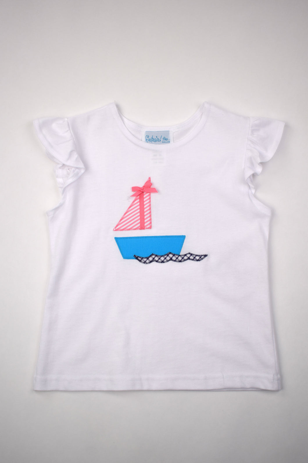Elevate your little girl's style with our Sailboat Angel Sleeve Tee from Funtasia Too! Adorned with a charming sailboat applique and delicate flutter sleeves, this tee is perfect for any summer day. Complete the adorable outfit with our Ruffle Navy Check Shorts.