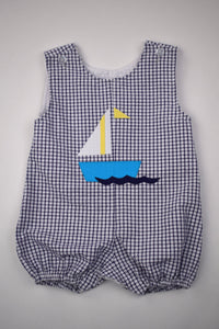 Sail away in style with our Sailboat Gingham Bubble! Designed for toddler boys, this bubble features a charming navy and white gingham print with a playful sailboat applique. Perfect for any summer adventure, this bubble will keep your little one cool and comfortable.