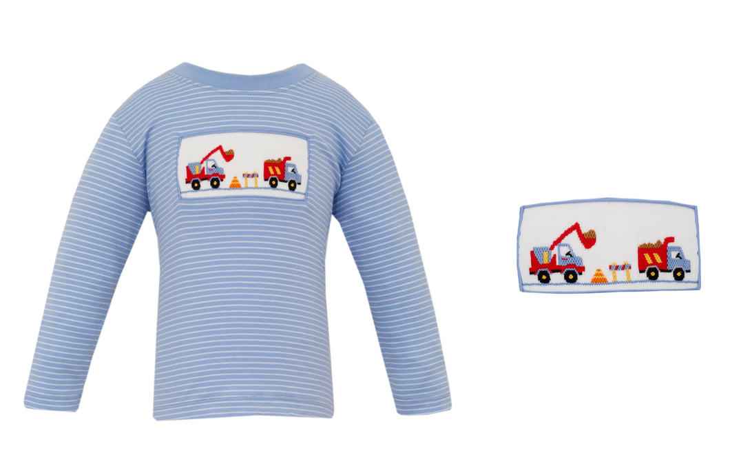 The Boys Smocked Periwinkle Knit Stripe Dump Truck Tee by Anavini combines comfort and charm with its soft, long-sleeve knit fabric. Highlighted by a detailed smocked and embroidered dump truck design, this tee adds playful style to any little boy’s wardrobe!