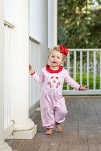Load image into Gallery viewer, The Gingerbread House Romper by Trotter Street Kids wraps your little one in cozy warmth with soft pink and white knit, accented by a charming gingerbread house appliqué and festive red ruffles. Perfect for joyful Christmas moments and chilly days!
