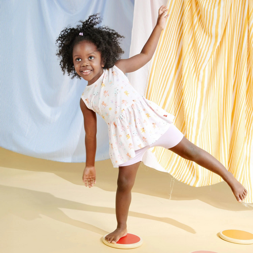The Toddler Girls Playground Pals Tunic Set from Magnetic Me combines comfort and convenience with style. Crafted from durable, soft TENCEL™ modal, the tunic features easy magnetic closures for quick dressing, while the fitted shorts with an elastic waist ensure all-day comfort. Perfect as a coordinated outfit or mixed with other favorites, this set is designed for everyday play and effortless wear.