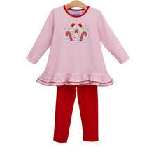 Load image into Gallery viewer, Celebrate the magic of the season with the Gingerbread House Pant Set by Trotter Street Kids. The cozy pink and white knit tee, featuring a charming gingerbread house appliqué, pairs perfectly with soft red leggings—comfort and festive style wrapped into one delightful outfit!
