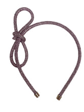 Load image into Gallery viewer, Introducing the Glitter Bow Slim Headband from Anuja Tolia Jewelry! This bedazzled headband features a stunning accent bow and comes in 3 different colors. Perfect for any young fashionista looking to add a touch of sparkle and style to their outfit!
