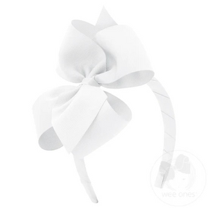 The perfect everyday headband, this 3/4" tapered headband is topped off with a matching Small King grosgrain hair bow for girls.&nbsp;Approximate Size: 5.5” x 4” (2.25” Ribbon)