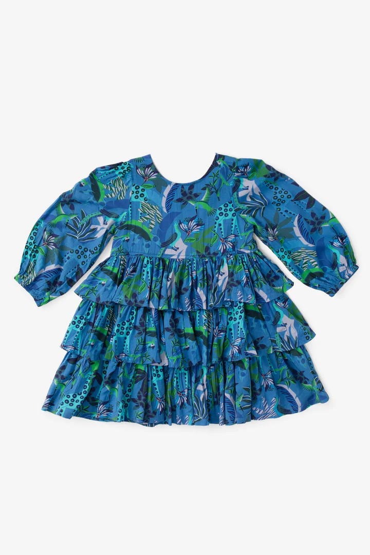 Add a touch of fun and fashion to your tween's wardrobe with the Blue Turquoise Goldie Dress. The Briton Court Goldie Dress features a beautiful floral and animal print, along with tiered ruffled skirt and bubble sleeves for a stylish and unique look. Perfect for any occasion, this dress will quickly become a go-to favorite.