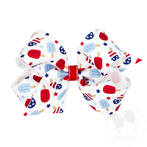 The perfect finishing touch for summer BBQs and fireworks! This Medium Grosgrain hairbow features an adorable patriotic Popsicle print to compliment any red, white, and blue outfit.This bow is sure to stay in her hair all day with our patented WeeStay™ no-slip hair clip.