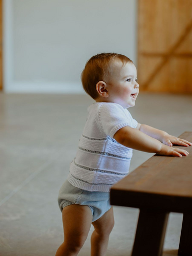 Dress your little one in style with our Boy's Knit Sweater and Diaper Cover Set! Made from soft materials, this set features a classic blue and white striped design. Perfect for infant boys, this adorable and timeless outfit will keep them cozy and cute.