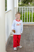 Load image into Gallery viewer, Celebrate the magic of the season with the Gingerbread Train Pant Set by Trotter Street Kids. The cozy blue and white striped tee, featuring a charming gingerbread train appliqué and vibrant red accents, pairs perfectly with bright red pants—bringing holiday joy to your toddler’s wardrobe!

