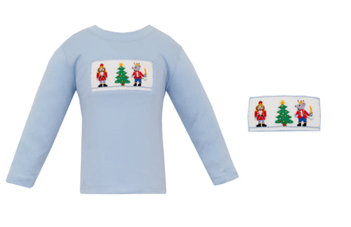 Experience the magic of the holiday season with our Anavini Boy's Smocked Nutcracker Tee! Crafted with blue knit fabric and adorned with nutcracker-themed smocking, this tee is perfect for your little one's holiday festivities. Let your child spread joy and cheer with this charming and comfortable shirt!