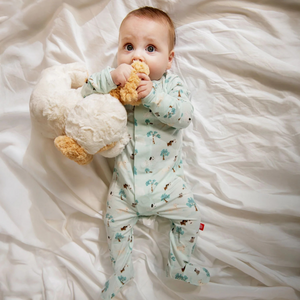 The Central Bark Zipper Footie is a must-have for everyday wear and nighttime comfort. Featuring quick, quiet magnetic closures, it makes dressing and middle-of-the-night changes effortless. Crafted from eco-friendly TENCEL™ modal, this footie is silky soft, breathable, and gentle on sensitive skin. Its temperature-regulating fabric keeps your little one warm in winter, cool in summer, and comfortable all year long. Experience convenience and cozy softness in one perfect piece.