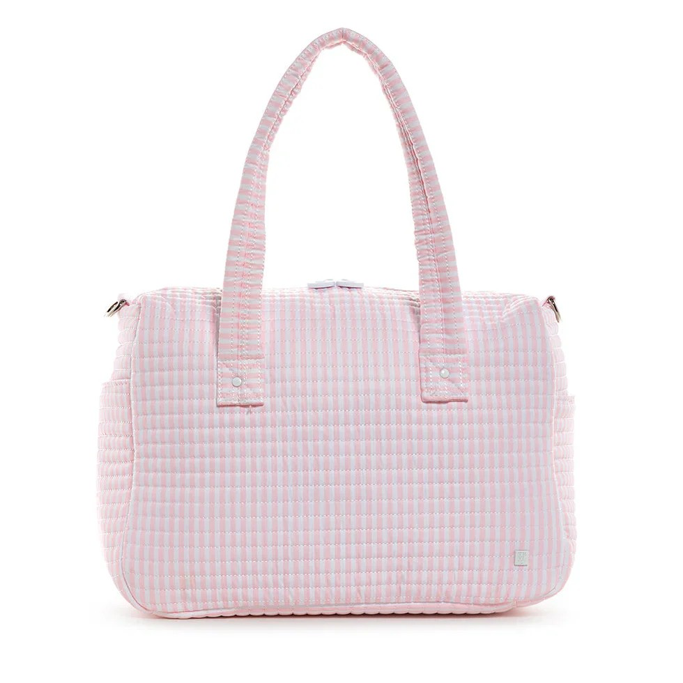 Fit all of your essentials with ease when you carry this perfectly designed Stroller Bag that can be worn as a tote, crossbody, or it can be Velcro onto your stroller.  Crafted in a water repellant material, this versatile bag features enough space to hold bottles, blankets, and toys for you and your baby. Built with interior pockets to hold essentials, 2 exterior side slip pockets for bottles, removable straps and is machine washable.