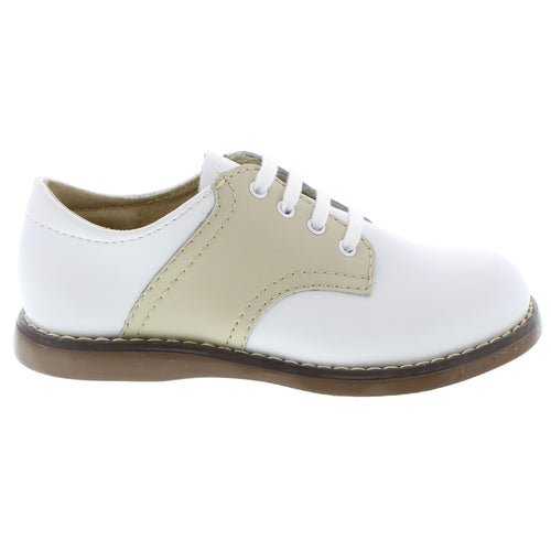 The Footmates Cheer Saddle Shoe in White/Ecru is a classic, two-tone blucher leather saddle oxford that is perfect for any special occasion. With its premium smooth leather upper and traditional design, these shoes are both stylish and comfortable.