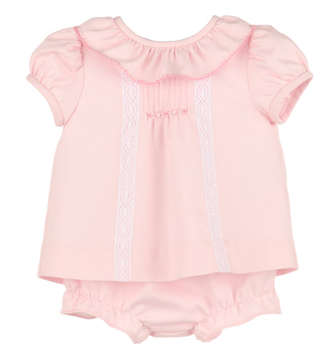 Dress your baby girl in timeless elegance with the Infant Girls Pintuck Lace Bishop in pink. This classic dress features delicate pintuck detailing and lace accents, creating a refined look perfect for special occasions. Soft and comfortable, it highlights your little one’s charm while ensuring she feels cozy. Ideal for celebrations or photo moments, this dress makes every event memorable. Includes matching bloomers.