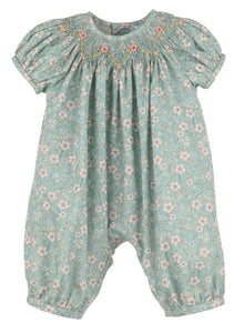 Dress your little one in timeless elegance with the Winter Blooms Aqua Bishop Bubble from Luli &amp; Me. Featuring a delicate floral pattern, a smocked bishop neckline, and intricate embroidered details, this long bubble combines classic style with all-day comfort. Perfect for special occasions, it ensures your child looks charming while feeling cozy and free to move.
