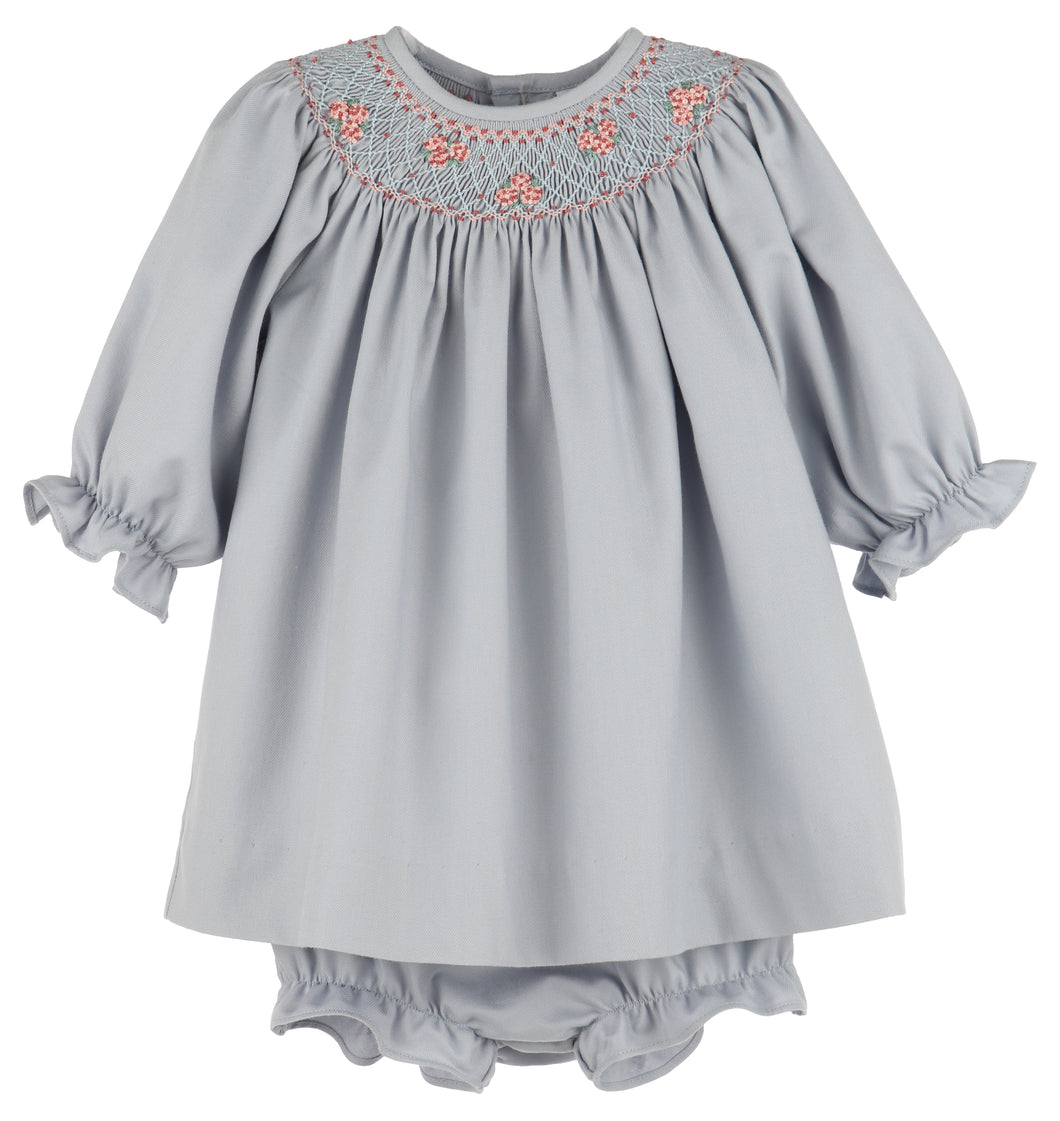 Dress your little one in timeless elegance with the Infant Girls Hydrangea Smocked Bishop by Luli & Me. Featuring exquisite smocking and delicate embroidery along the bishop neckline, this dress adds a touch of sophistication to any fall occasion. Paired perfectly with the matching diaper cover, it ensures comfort without compromising style. Ideal for special events, this charming outfit highlights your infant’s natural beauty while keeping her cozy and looking adorable.