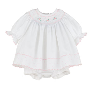 Dress your little one in timeless charm with the Infant Girl's Classic Embroidery Bishop Dress from Luli &amp; Me. This beautiful white bishop dress features delicate hand-smocking and embroidery on the neckline, adding a touch of classic elegance in pink. Complete with a matching bloomers, it ensures both style and comfort for your infant. Perfect for special occasions or festive moments, this dress makes your baby shine with joyful brightness.