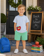 Load image into Gallery viewer, Dress your little one in Zuccini Kid’s ABC Light Blue Harry’s Play Tee, where playful apple appliqués meet soft, breathable fabric. Perfectly paired with Covington Green Knit Leo Shorts, this vibrant outfit inspires confidence and joy—ideal for the first day or any day of school!
