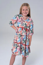Load image into Gallery viewer, The Hattie Bow Dress by Briton Court dazzles with its elegant tiers and charming bow print, enhanced by rich red velvet accents. Designed for tween girls, it’s the perfect choice to celebrate every holiday moment with grace and festive style!
