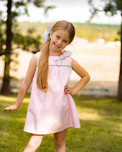 Load image into Gallery viewer, Introducing the Annie Bow Dress from The Yellow Lamb, a must-have for toddler girls. This light pink dress features a beautiful bow on one shoulder with colorful ric rac detail. Dress up your little one in style and complete the look for sisters with the matching pantaloon set for infant girls.
