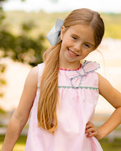 Load image into Gallery viewer, Introducing the Annie Bow Dress from The Yellow Lamb, a must-have for toddler girls. This light pink dress features a beautiful bow on one shoulder with colorful ric rac detail. Dress up your little one in style and complete the look for sisters with the matching pantaloon set for infant girls.
