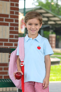 This classic light blue polo elevates your boy's back-to-school wardrobe with its charming apple applique logo. Perfect for classroom style or special occasions, this versatile shirt combines timeless design with playful details. Give your little one the confidence of looking polished while celebrating the school season in adorable fashion