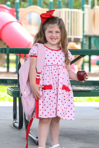Delight your little one with this charming Apple Print Dress, designed specifically for toddler girls. The playful apple pattern combined with sweet ruffle details creates an irresistible look that's perfect for back-to-school season. Crafted from comfortable cotton, this Trotter Street dress offers both style and practicality with its short sleeves—ideal for active play while keeping her looking adorable all day long.