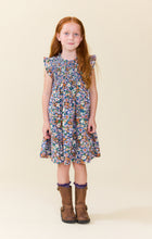 Load image into Gallery viewer, Pink Chicken’s Girls Stevie Dress in True Blue Sketched Floral bursts with vibrant colors and lively florals, making every moment feel joyful and bright. Perfect for tween girls who love playful, spirited style that stands out effortlessly.

