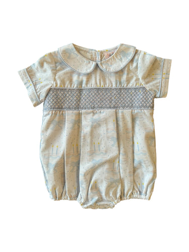 Make his birthday unforgettable with the Boys Neck Birthday Smocked Bubble from Shop Teeta. Featuring charming smocked accents and a delicate birthday cake print, this bubble combines festive style with soft, comfortable fabric. Designed to keep him cozy and looking adorable, it's ideal for capturing precious moments and celebrating in comfort. Let this special outfit add a touch of magic to his big day and create memories that last a lifetime.