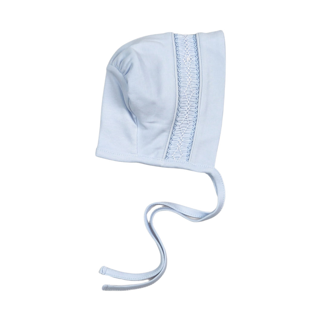 The Tim Blue Hand Smocked Pima Bonnet from Baby Loren offers gentle comfort with its soft blue fabric and delicate hand-smocked detailing. Crafted from premium Pima cotton, this bonnet ensures a cozy fit while adding a timeless, charming touch to your baby’s outfit. Perfect for keeping your little one comfortable and stylish throughout the day.