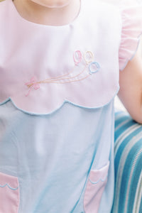 Infant Girls Birthday Balloon Bubble from The Proper Peony. The pink and blue combination is stunning and each scallop is hand-cut. The look is delicate and lovely. The perfect style for any birthday occasion or any other happy day.