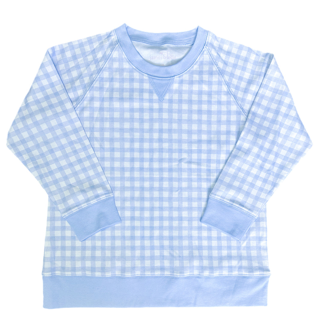 The Girls Blue Gingham Sweatshirt from James & Lottie offers a perfect blend of comfort and classic style. This lightweight sweatshirt keeps your little girl cozy without the bulk, making it ideal for layering. Its timeless gingham pattern adds a charming touch, effortlessly pairing with scalloped hem leggings for a polished, comfortable outfit. Elevate her wardrobe with this versatile essential made for everyday wear.