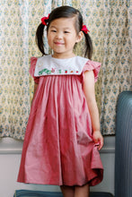 Load image into Gallery viewer, Celebrate your little reader’s style with the Girls Red Bookworm Dress from The Proper Peony. This charming dress features a delightful embroidered bookworm on the front and playful ruffle sleeves, all in a soft heathered red fabric. It’s the perfect back-to-school outfit that combines comfort and cuteness, making every day a storybook adventure for your little bookworm.

