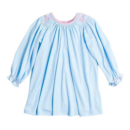 This toddler Girl's Juno Bow Dress in soft light blue combines charming details with comfort. Featuring delicate smocking and a hand-embroidered bow detail adds a touch of elegance to your little one’s wardrobe. Crafted for softness and ease, it ensures your girl stays comfortable while looking irresistibly sweet.
