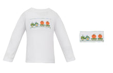 Load image into Gallery viewer, Boy's Pumpkin Smocked T-Shirt and Pant Set from Petit Bebe. Features a charming tractor pulling a load of pumpkins on the smocked tee, paired with matching plaid pants. Perfect for fall festivities and everyday wear.
