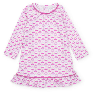 Celebrate in style with the Carlin Girls' Lounge Dress in Birthday Cake Pink by Lila &amp; Hayes. This charming dress features a playful birthday-themed print, making it the perfect pajama dress for any special celebration. Pair it with the matching doll dress &amp; boy’s shorts set for coordinated birthday moments that everyone will love.