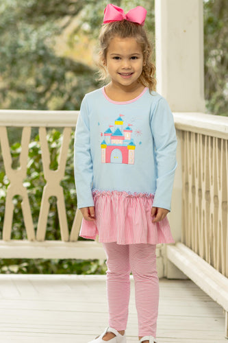 Girls Ruffle Castle Legging Set from Trotter Street Kids. This delightful set includes an aqua tunic adorned with a whimsical castle applique and a playful ruffle hem, paired perfectly with coordinating striped leggings for comfort and style. Ideal for playdates or special outings, it combines cozy fabrics with enchanting design.