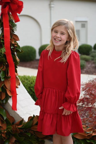 Get ready for the holiday season with our Cece Dress in Christmas Red! This stylish girl's dress features a cozy sweatshirt top, ruffled sleeves and skirt, ideal for staying warm while looking festive. Perfect for Christmas or any fall occasion, it's a must-have addition to your little one's wardrobe.