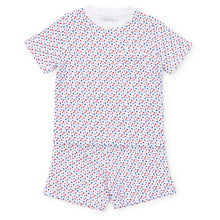 Load image into Gallery viewer, Experience the ultimate comfort and style with our Star Spangled Charles Pajama Short Set from Lila &amp; Hayes. Made from soft cotton material, this set includes a short sleeve shirt and coordinating shorts, adorned with fun red and blue stars. Perfect for a cozy night&#39;s sleep or lounging around in style.
