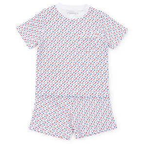 Experience the ultimate comfort and style with our Star Spangled Charles Pajama Short Set from Lila &amp; Hayes. Made from soft cotton material, this set includes a short sleeve shirt and coordinating shorts, adorned with fun red and blue stars. Perfect for a cozy night's sleep or lounging around in style.