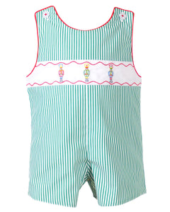 Dress your little one in festive charm with the Boys Jean Nutcracker Jon Jon from The Yellow Lamb. This adorable outfit features a classic green and white stripe pattern accented by detailed nutcracker embroidery on the front. Ideal for Santa visits or family photos, it combines comfort and holiday spirit effortlessly, making your baby the star of any seasonal occasion.
