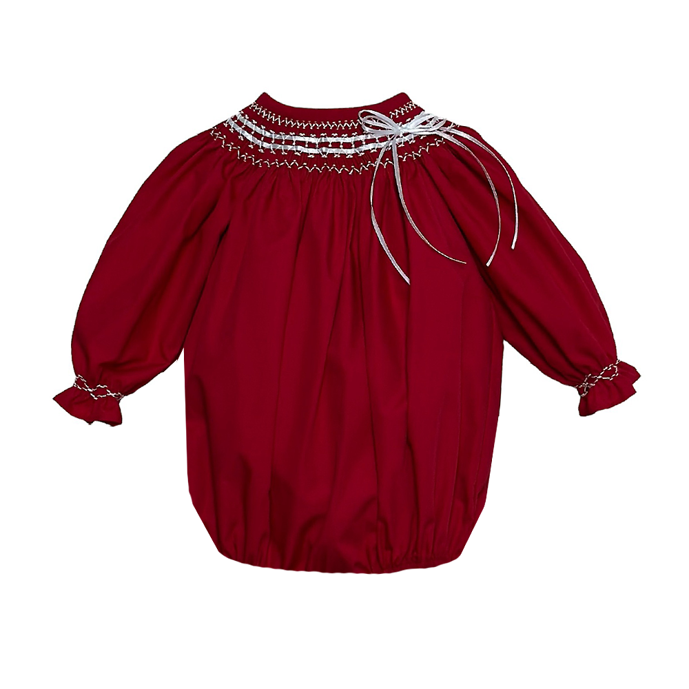 Get your little one ready for the holiday season with our Classic Ribbon Red Bubble from Zuccini Kids. Made from soft and comfortable Broadcloth, this bubble features a timeless classic collar with charming ribbon and smocking detail. Perfect for any festive occasion, your baby boy will look adorable and festive in this classic Christmas attire.