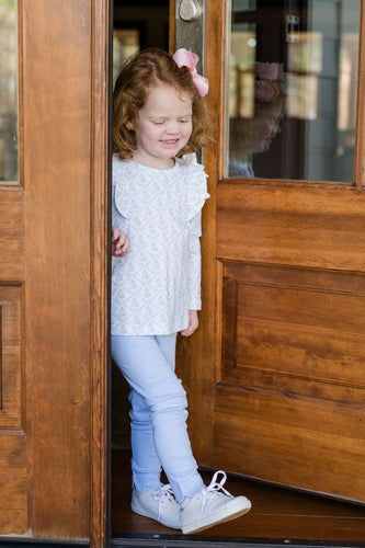 The Girls Favorite Things Legging Set from James & Lottie offers a charming combination of style and comfort. Featuring a pastel-colored Christmas tree print on a ruffled shoulder top paired with coordinating blue leggings, this set is perfect for toddlers and young girls. Its festive design and soft fabric make it ideal for holiday gatherings or everyday wear, ensuring your little one stays cozy and stylish all season long.