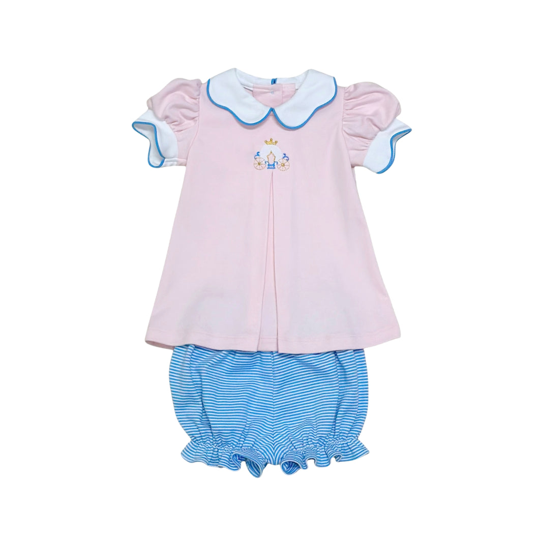 Dress your little princess in the Carriage Ella Bloomer Set from Zuccini Kids, featuring a charming long collared knit tunic with a delicate front pleat and an embroidered magical princess carriage. This adorable outfit pairs perfectly with coordinating bloomers for comfort and style. Ideal for your youngest princess, it also has a matching big sister dress to create a delightful sibling look. Elevate your child's wardrobe with this enchanting and comfortable set today.