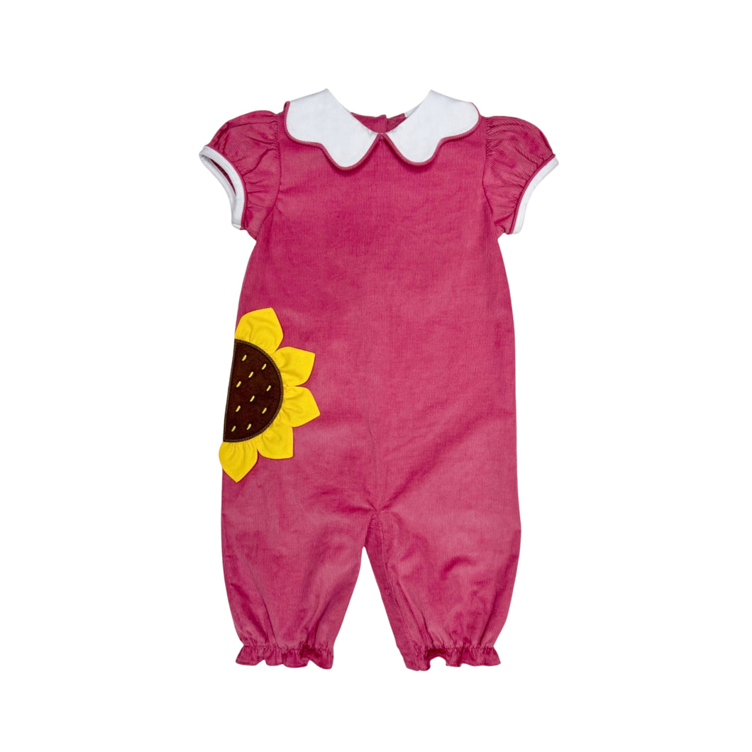 The Sunflower Louisa Corduroy Bubble from Zuccini Kids combines cozy softness with charming details like a sunflower applique and a delicate peter pan collar. Crafted from gentle corduroy, this long bubble suit keeps your little girl comfortable and stylish during fall gatherings. Ideal for infants and young toddlers, it also pairs perfectly with a matching dress for bigger toddlers.