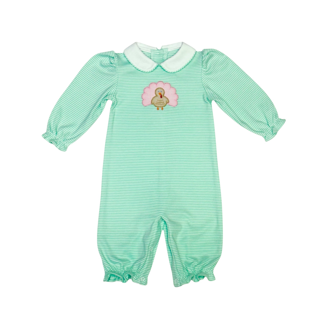 Dress your little one in festive charm with the Infant Girls Turkey Louisa Bubble from Zuccini Kids. Crafted from soft mint and white striped knit fabric, this long bubble features a delightful turkey applique at the front, perfectly capturing Thanksgiving spirit. Comfortable and cute, it’s an ideal outfit for your infant girl to celebrate the holiday in style and coziness.