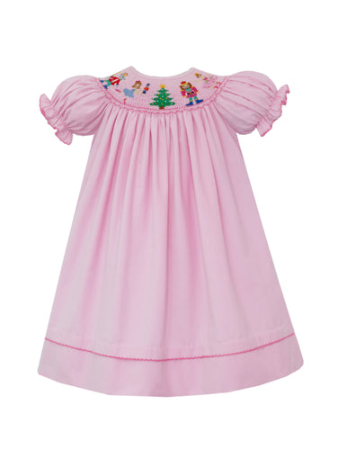 Elevate your little girl's holiday style with our Girl's Smocked Nutcracker Corduroy Bishop Dress by Anavini! This adorable pink corduroy dress features exquisite nutcracker smocking, perfect for adding a festive touch to any occasion. Let her twirl into the season with this elegant and charming dress!