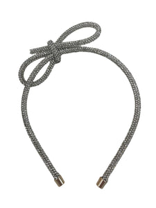 Introducing the Glitter Bow Slim Headband from Anuja Tolia Jewelry! This bedazzled headband features a stunning accent bow and comes in 3 different colors. Perfect for any young fashionista looking to add a touch of sparkle and style to their outfit!