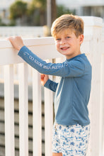 Load image into Gallery viewer, Introducing the Tybee Rashguard, your perfect companion for a summer of fun in the sun! Designed with classic blue or white colors and featuring the Salt Water Boys fish logo, this shirt will not only protect you from the sun but also add a touch of style to your beach and pool days. Get ready to make a splash and show off your bold fashion sense with the Tybee Rashguard!
